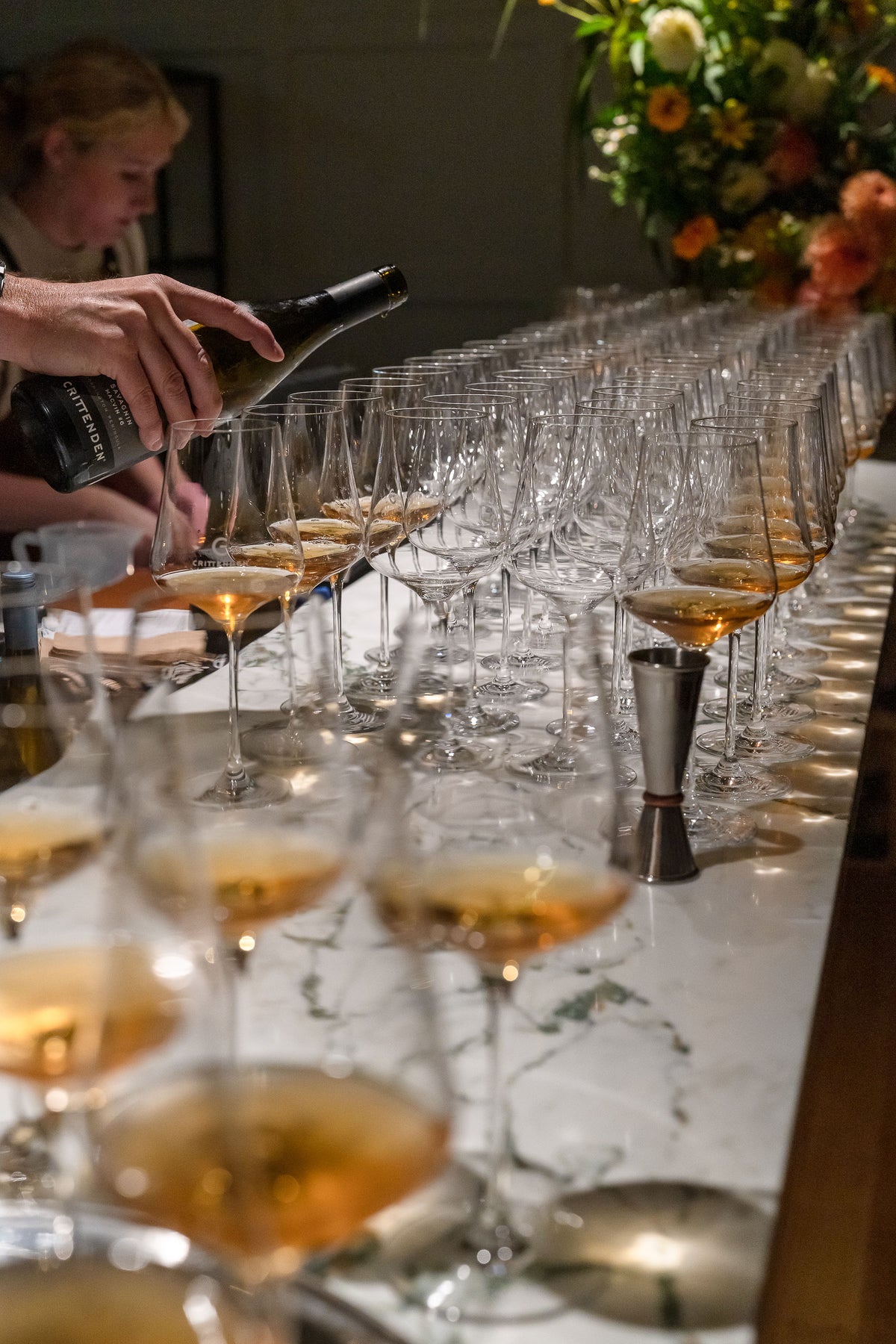 Rows of glasses being filled for a function