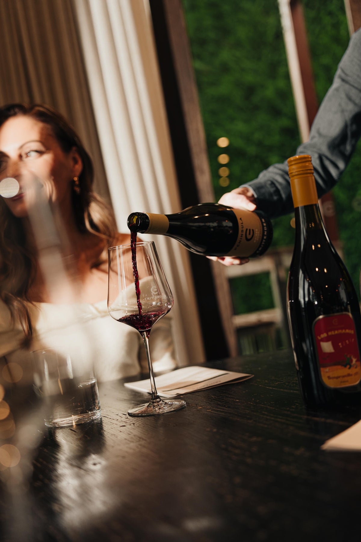 Pinot Noir being poured for a guest at a cellar door tasting